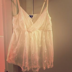 White lace top with ribbon accent under the bodice